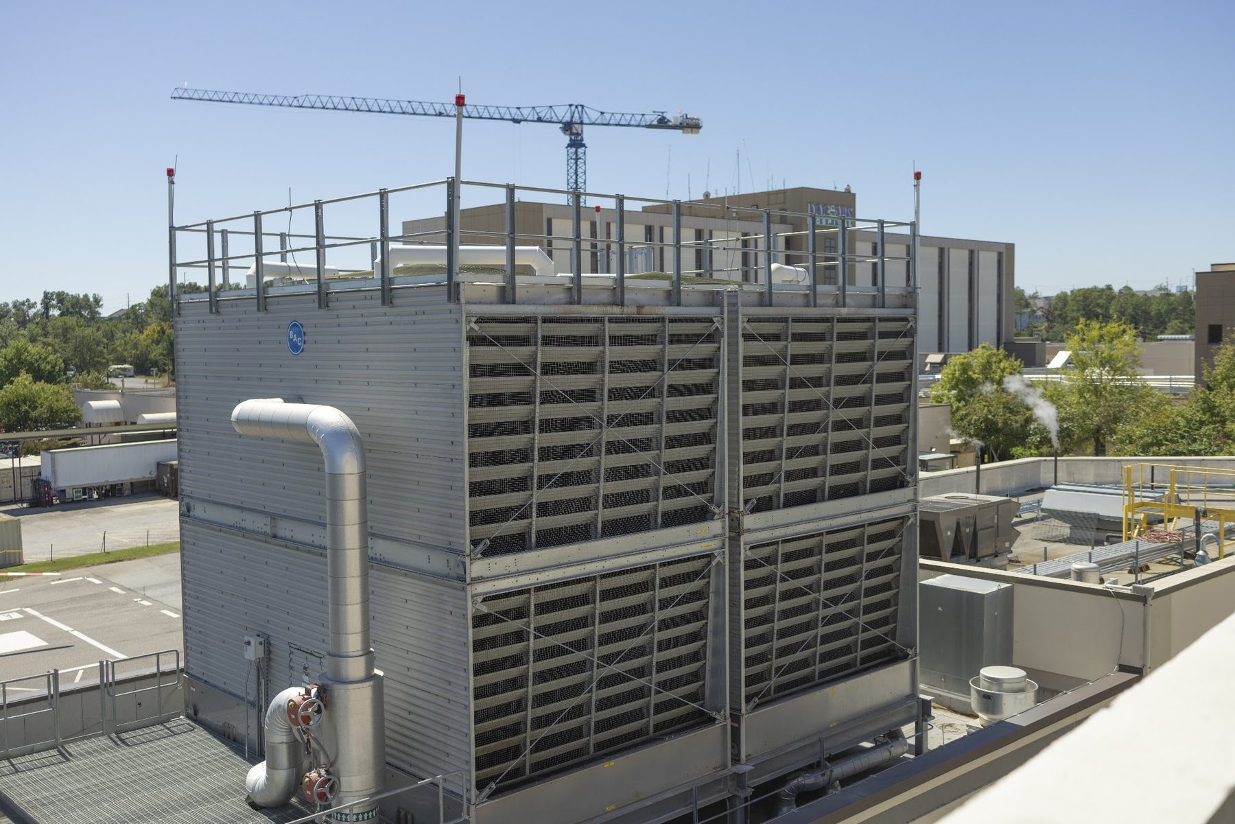 Line of commercial cooling towers serviced by Augusta Chiller Service